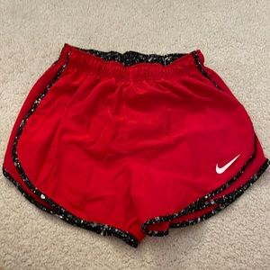 Red Nike running shorts
